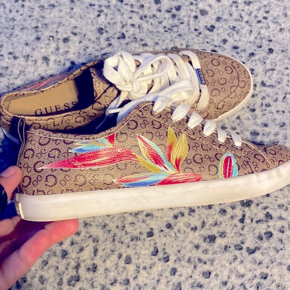 This Is a very beautiful shoe from guess with designs on the side and is brown. - Picture 4 of 4